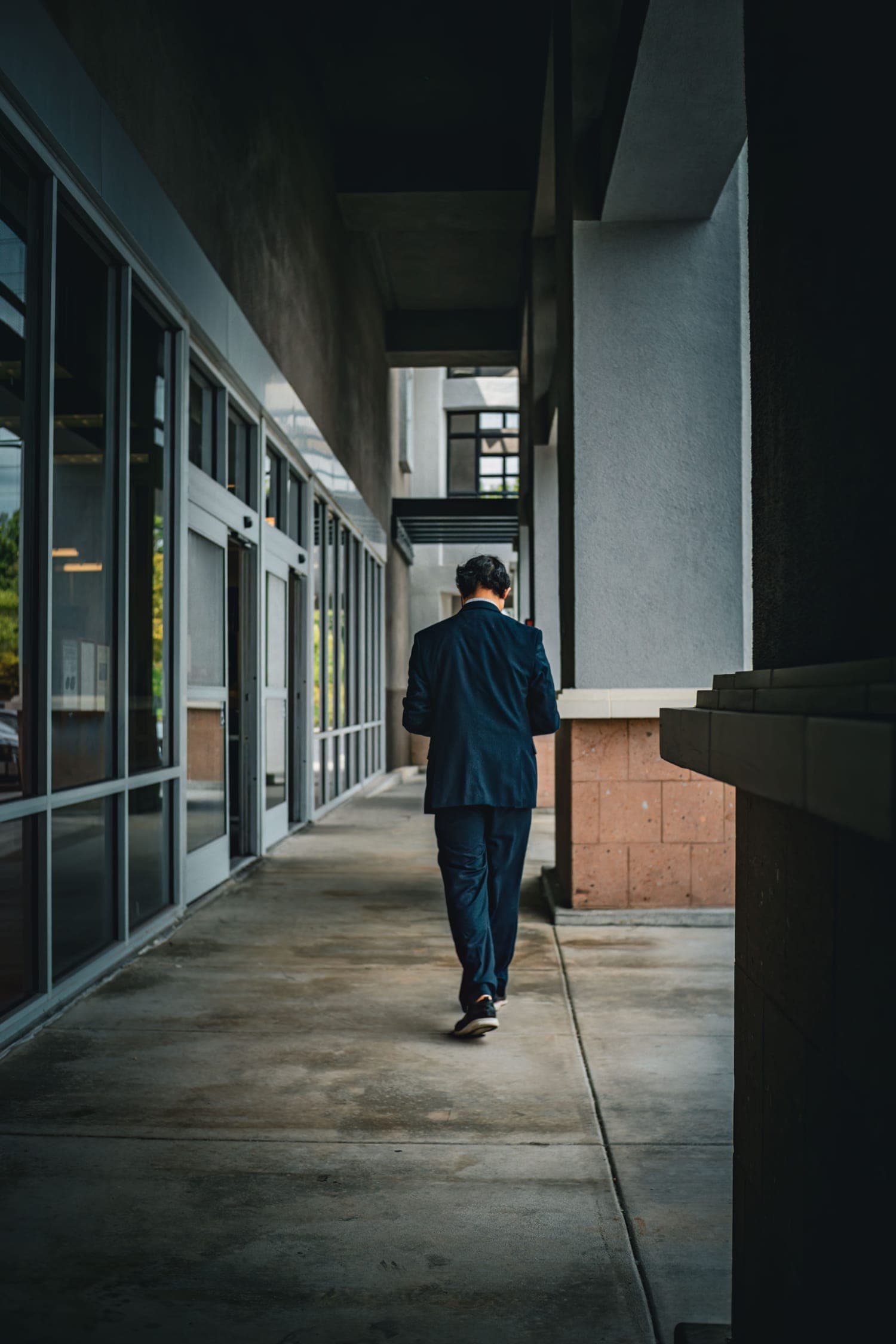 A business leader walking alone